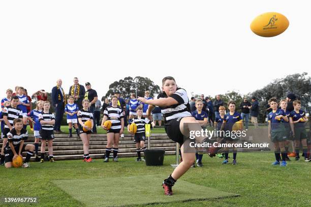 Junior club rugby players kick balls during a Rugby Australia media opportunity announcing Australia winning their Rugby World Cup 2027 & 2029 bid,...