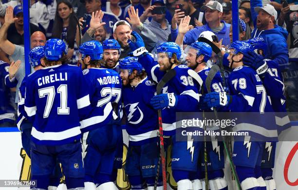 The Tampa Bay Lightning celebrate winning Game Five of the First Round of the 2022 Stanley Cup Playoffs on a goal by Brayden Point against the...