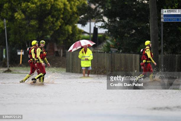 Swift Water Rescue crew make their way through floodwater on May 13, 2022 in Laidley, Australia. Parts of southeast Queensland are on flood watch as...
