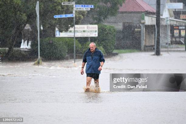 Man walks through floodwater on May 13, 2022 in Laidley, Australia. Parts of southeast Queensland are on flood watch as the state continues to...