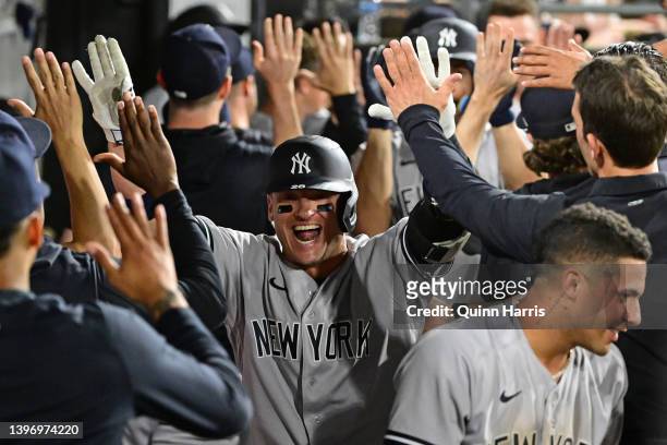 Josh Donaldson of the New York Yankees reacts in the dugout with teammates after his home run in the eighth inning against the Chicago White Sox at...