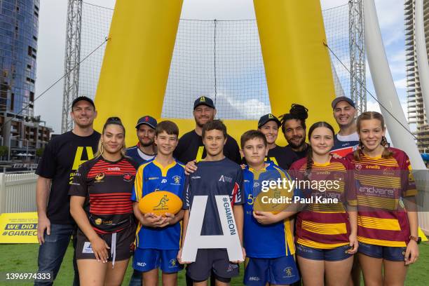 Dane Haylett-Petty, Scott Higginbotham, Selena Tranter and Digby Ioane pose with local club representatives during a Rugby Australia media...