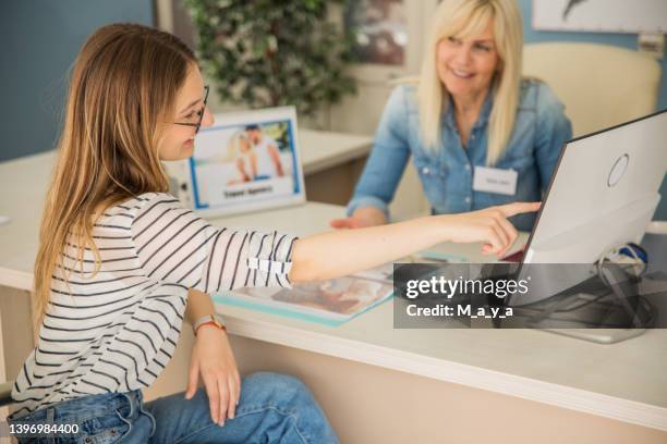 at travel agency - travel agency stock pictures, royalty-free photos & images