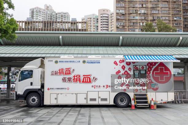 mobile blood donation vehicle in hong kong - blood donation truck stock pictures, royalty-free photos & images