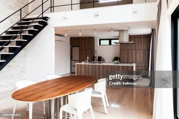 dining room and kitchen interior - minimalist living in japan stock pictures, royalty-free photos & images