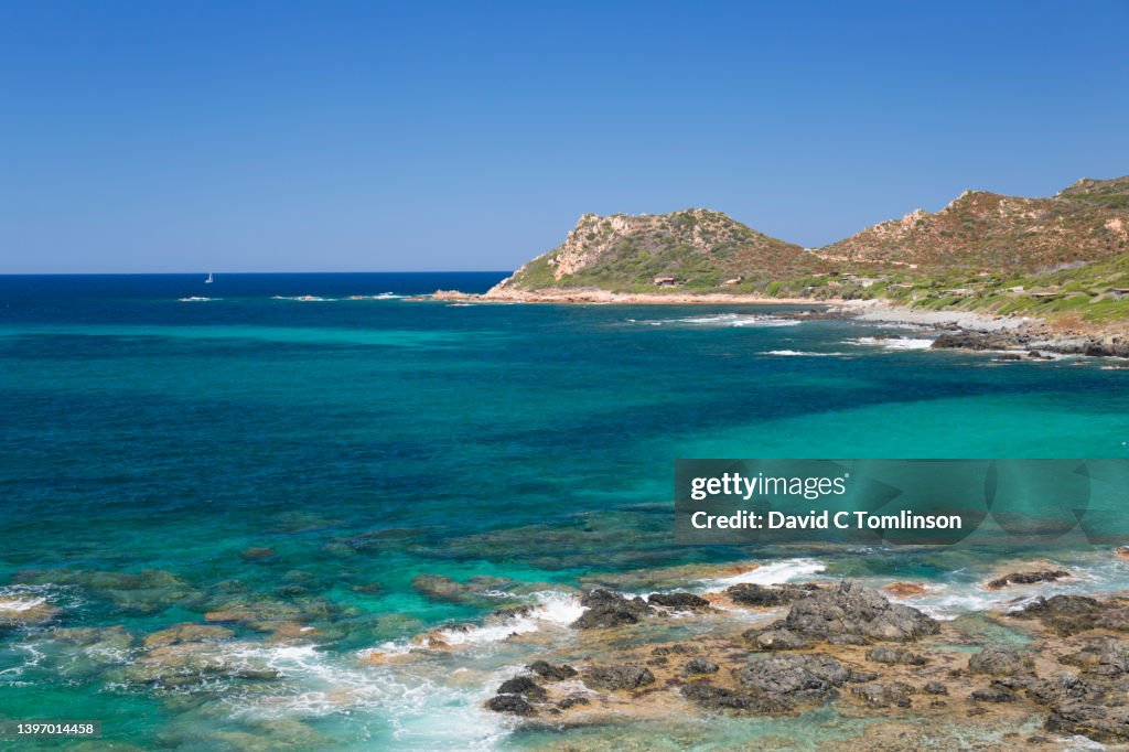 View from Pointe de la Parata across clear turquoise water to Pointe de la Corba, Ajaccio, Corse-du-Sud, Corsica, France