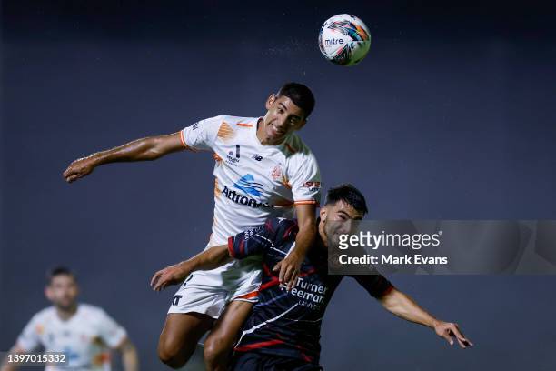 Juan Lescano of the Roar and John Koutroumbis of the Wanderers go up to head the ball during the Australia Cup Playoff match between the Western...
