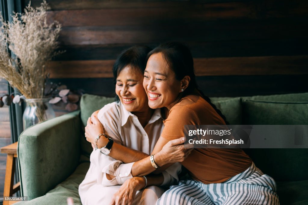 Mother And Daughter Hugging Each Other