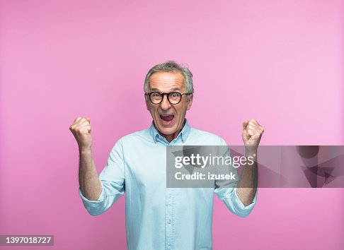Excited man shouting while gesturing with fists Excited man shouting while gesturing with fists