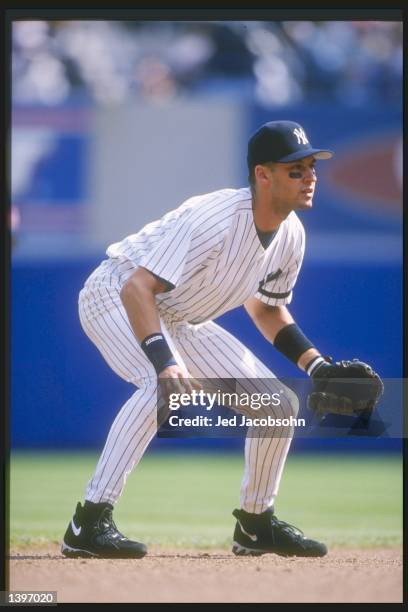 Shortstop Derek Jeter of the New York Yankees stands in position during a game against the Boston Red Sox at Yankee Stadium in Bronx, New York. The...