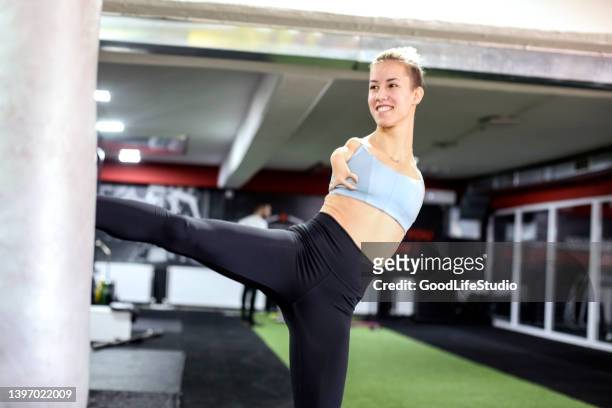 disabled woman exercising kickboxing - taekwondo stock pictures, royalty-free photos & images