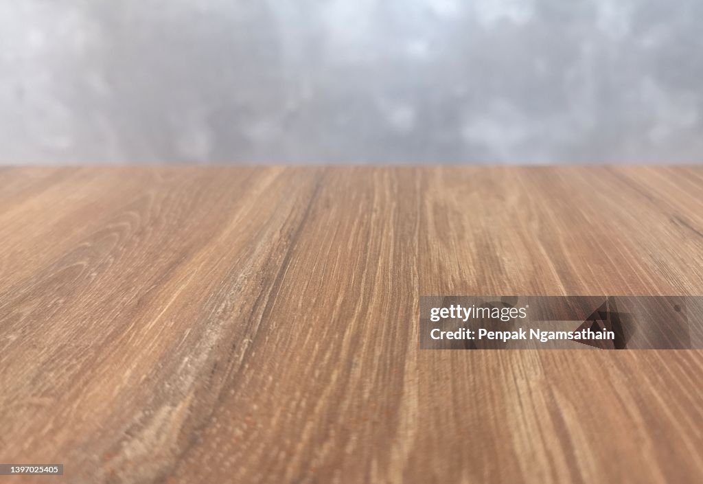 Brown Wooden floor and grey cement wall for display your product