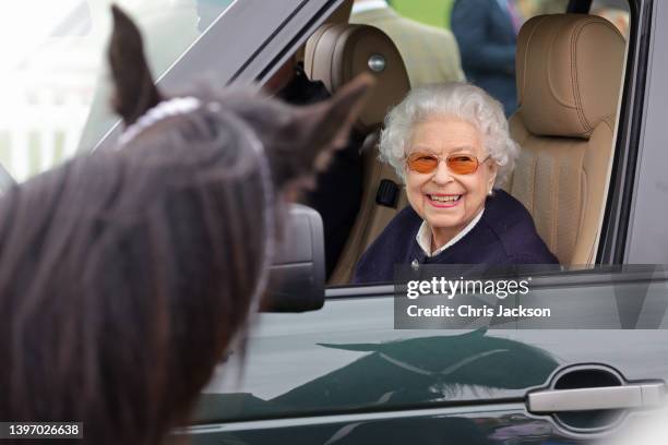 Queen Elizabeth II arrives at The Royal Windsor Horse Show at Home Park on May 13, 2022 in Windsor, England. The Royal Windsor Horse Show, which is...