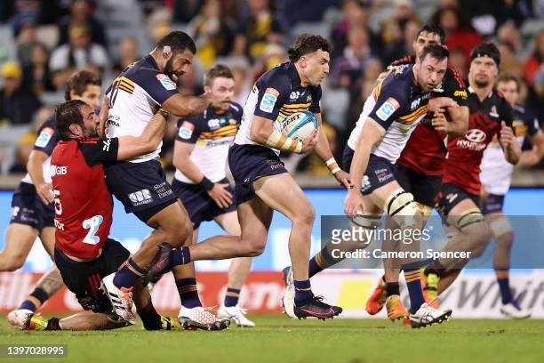 Tom Banks of the Brumbies makes a break during the round 13 Super Rugby Pacific match between the ACT Brumbies and the Crusaders at GIO Stadium on...