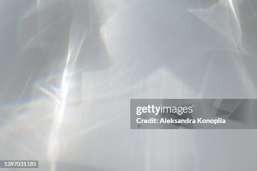 Blurred dreamy surreal rainbow light refraction texture overlay effect on white wall Blurred dreamy surreal rainbow light refraction texture overlay effect on white wall