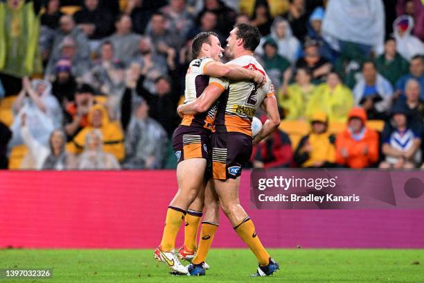 Corey Oates of the Broncos celebrates with Billy Walters after scoring a try during the round 10 NRL match between the Manly Sea Eagles and the...