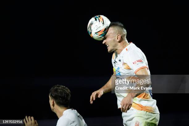 Thomas Aldred of the Roar heads the ball during the Australia Cup Playoff match between the Western Sydney Wanderers and the Brisbane Roar at...