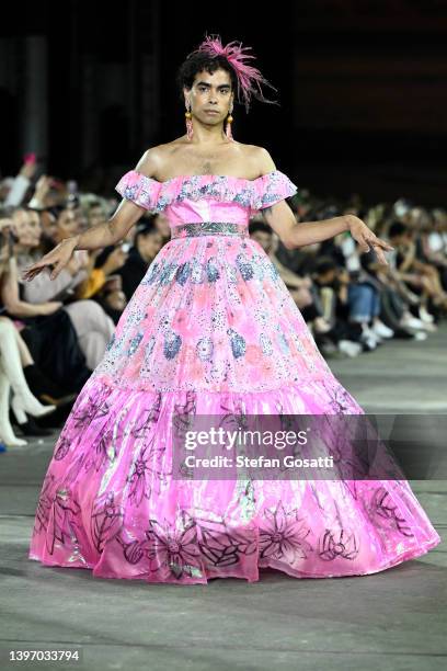 Model walks the runway in a design by Paul McCann during the First Nations Fashion + Design show during Afterpay Australian Fashion Week 2022 Resort...