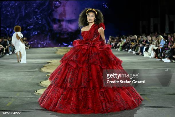 Model walks the runway in a design by Paul McCann x J'Aton Couture during the First Nations Fashion + Design show during Afterpay Australian Fashion...