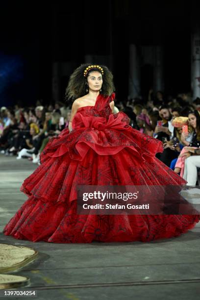 Model walks the runway in a design by Paul McCann x J'Aton Couture during the First Nations Fashion + Design show during Afterpay Australian Fashion...