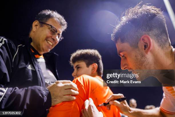 Luke Ivanovic of the Roar greets fans and signs autographs after their win during the Australia Cup Playoff match between the Western Sydney...