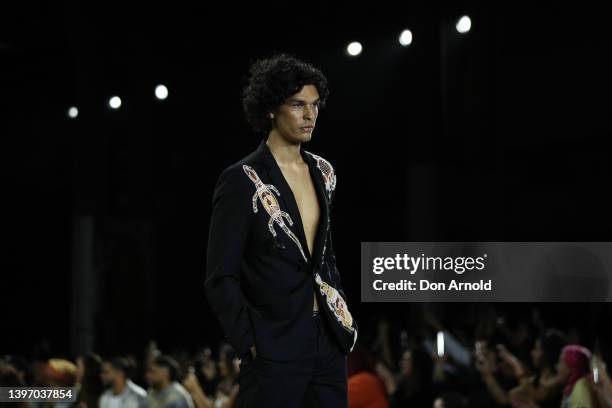 Model walks the runway during the First Nations Fashion + Design show during Afterpay Australian Fashion Week 2022 Resort '23 Collections at...