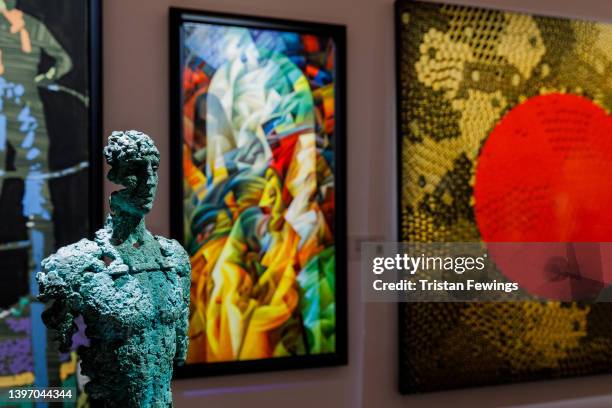 Works go on display at Sotheby's ahead of their sale in an auction to benefit families affected by the crisis in Ukraine, on May 13, 2022 in London,...