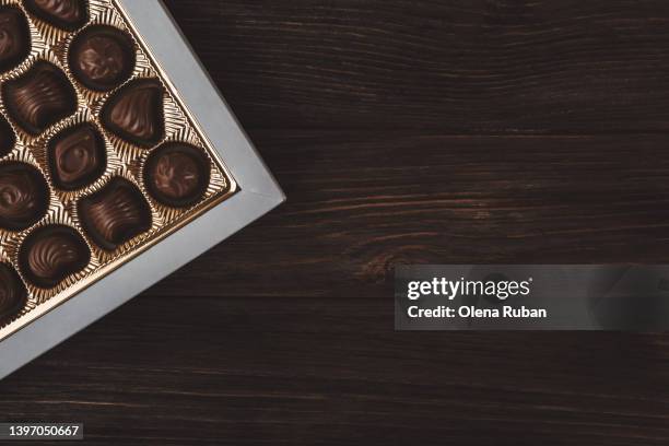 chocolate candies in box. - praline stock pictures, royalty-free photos & images