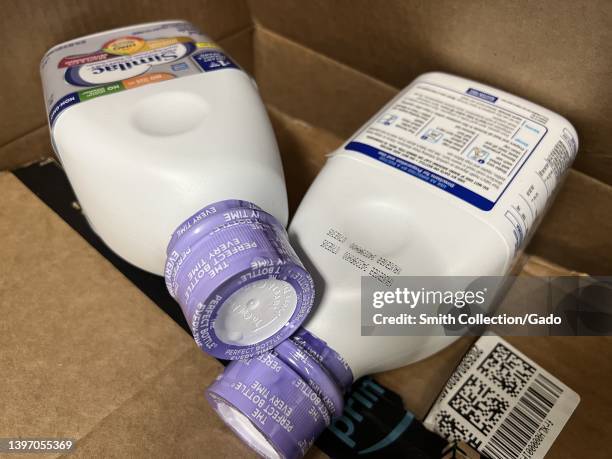 Bottles of Similac baby formula from Abbott Laboratories are visible in a shipment box, in Lafayette, California, May 13, 2022. Shortages of baby...