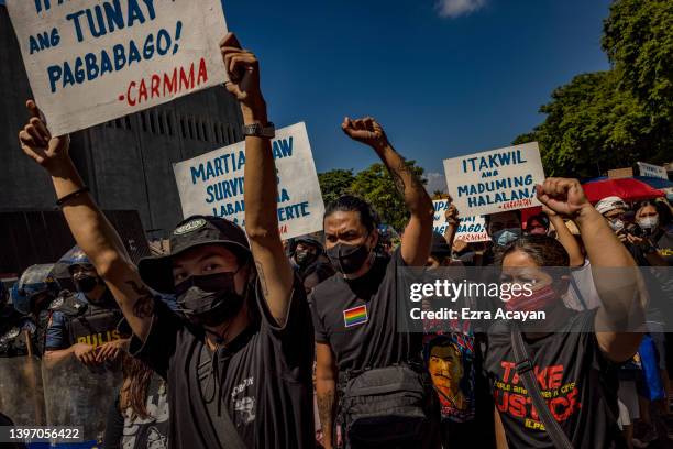 Filipinos take part in a protest against election results outside the Philippine International Convention Center, where votes are being canvassed, on...