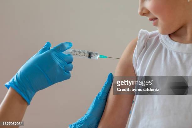 child getting vaccination - diphtheria stock pictures, royalty-free photos & images