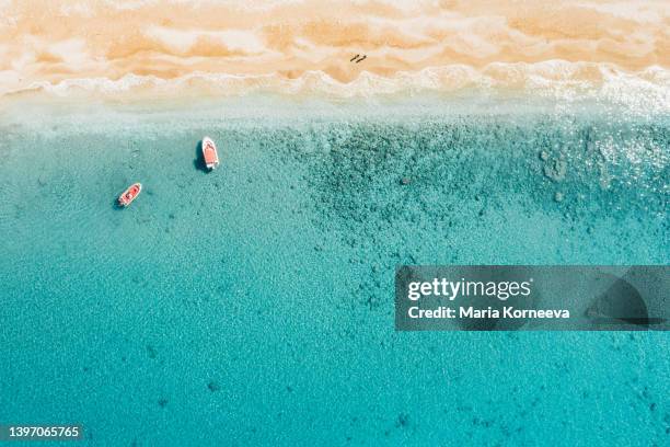 boats in the crystal sea from above. - mediterranean climate stock pictures, royalty-free photos & images