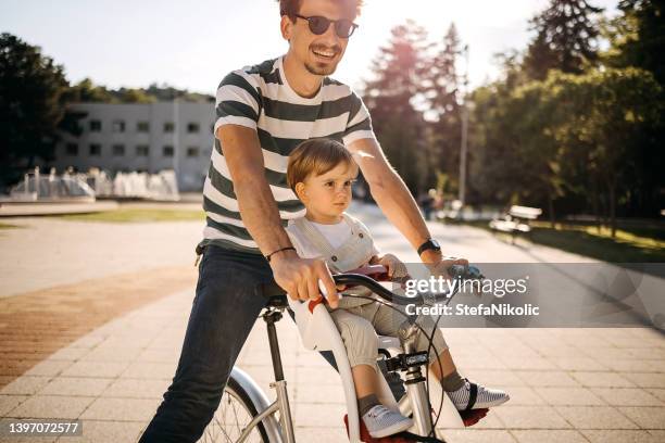 i feel safe with my dad - saddle stock pictures, royalty-free photos & images