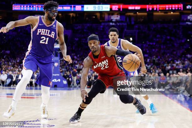 Jimmy Butler of the Miami Heat dribbles against Joel Embiid of the Philadelphia 76ers during the second half in Game Six of the 2022 NBA Playoffs...