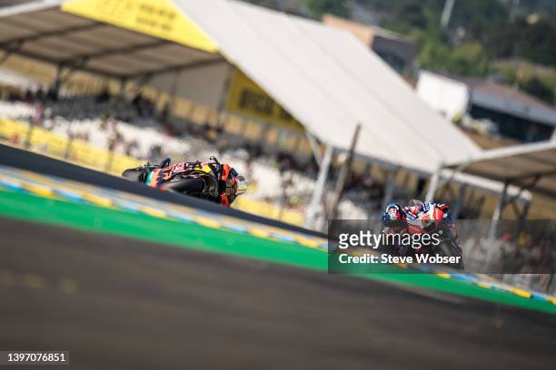 Johann Zarco of France and Pramac Racing rides next to Brad Binder's crashed bike during the free practice session of the MotoGP SHARK Grand Prix de...