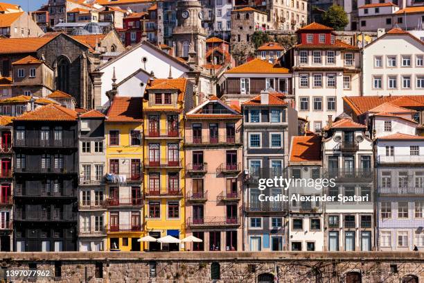 historical houses along waterfront of douro river in porto, portugal - porto district portugal stock pictures, royalty-free photos & images
