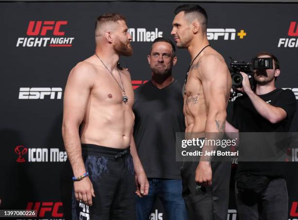 Opponents Jan Blachowicz of Poland and Aleksandar Rakic of Austria face off during the UFC Fight Night weigh-in at UFC APEX on May 13, 2022 in Las...