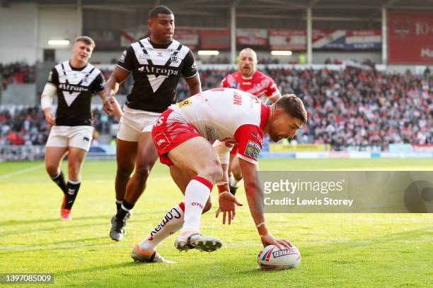 Tommy Makinson of St Helens goes over to score their side's first try during the Betfred Super League Round 12 match between St Helens and Hull FC at...