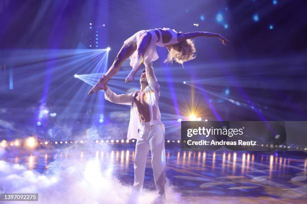 René Casselly and Kathrin Menzinger perform on stage during the 11th show of the 15th season of the television competition show "Let's Dance" at MMC...