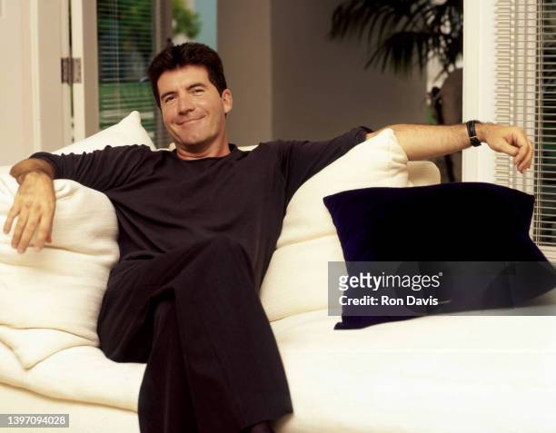 English television personality, entrepreneur, and record executive Simon Cowell, poses for a portrait circa 2002 in Los Angeles, California.