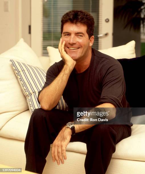 English television personality, entrepreneur, and record executive Simon Cowell, poses for a portrait circa 2002 in Los Angeles, California.