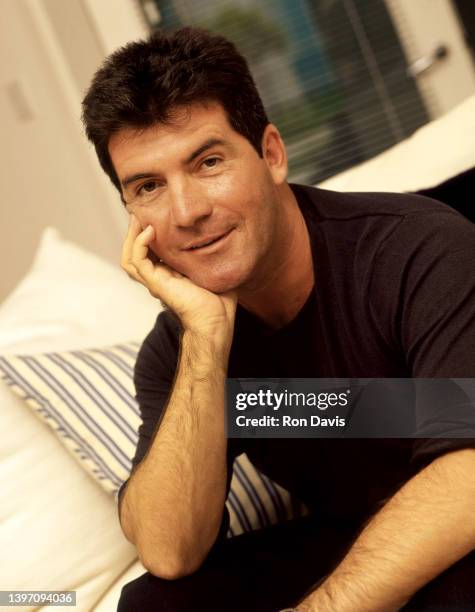 English television personality, entrepreneur, and record executive Simon Cowell, poses for a portrait circa 2002 in Los Angeles, California.