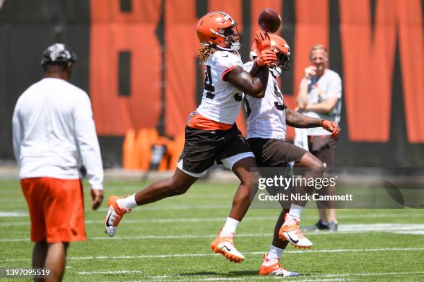 Alex Wright and Isaiah Thomas of the Cleveland Browns run a drill during the first day of Cleveland Browns rookie mini camp at CrossCountry Mortgage...