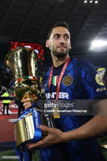 Hakan Calhanoglu of FC Internazionale poses with the trophy following the 4-2 victory in the Coppa Italia Final match between Juventus and FC...