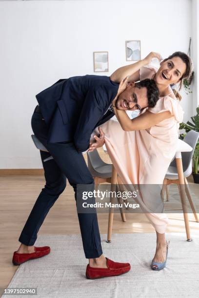 newly married couple fighting jokingly, having fun at home - naughty bride fotografías e imágenes de stock