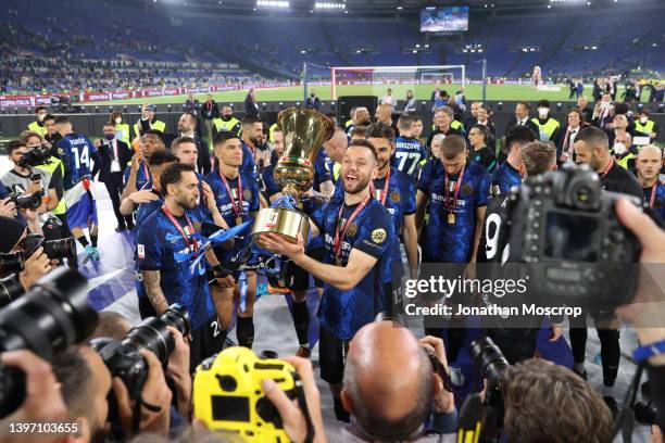 Stefan de Vrij of FC Internazionale celebrates in front of the fans with the trophy following the 4-2 victory in the Coppa Italia Final match between...