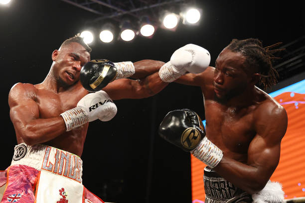 Denzel Bentley lands a punch on Linus Udofia during their BBBofC British Middleweight Title fight at Indigo at The O2 Arena on May 13, 2022 in...