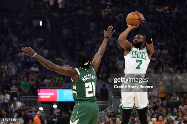 Jaylen Brown of the Boston Celtics shoots the ball over Jrue Holiday of the Milwaukee Bucks during the first quarter in Game Six of the 2022 NBA...