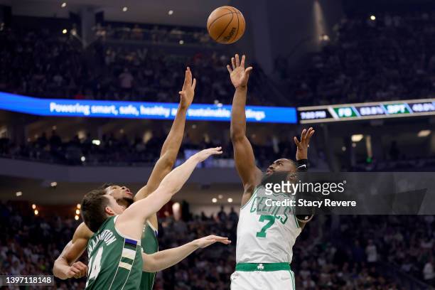 Jaylen Brown of the Boston Celtics shoots the ball over Pat Connaughton of the Milwaukee Bucks during the first quarter in Game Six of the 2022 NBA...