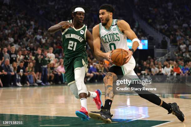 Jayson Tatum of the Boston Celtics drives to the basket against Jrue Holiday of the Milwaukee Bucks during the first quarter in Game Six of the 2022...